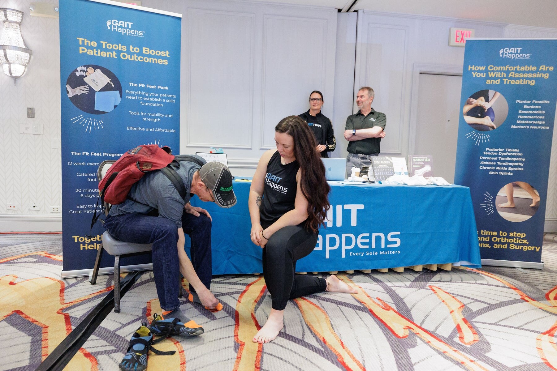Visitors receiving individual advice at the Gait Happens stand, photo by Barefoot Shoe Expo